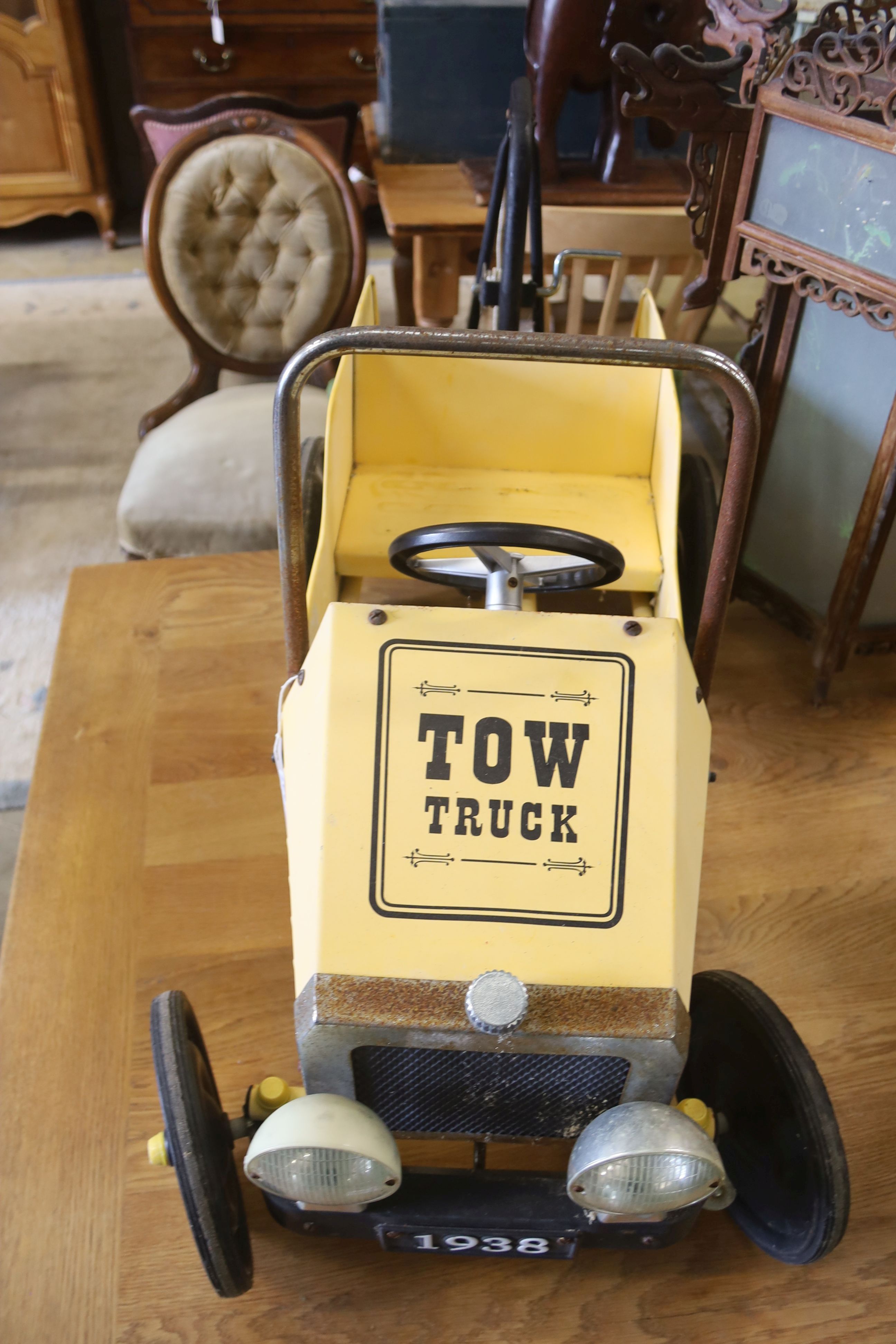 A child's tin plate pedal car tow truck, length 94cm